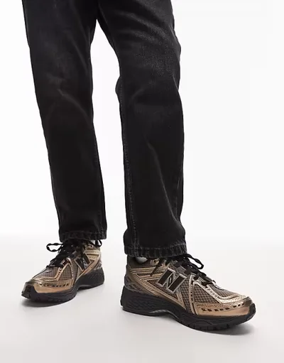 New Balance 1906R unisex trainers in gold and black